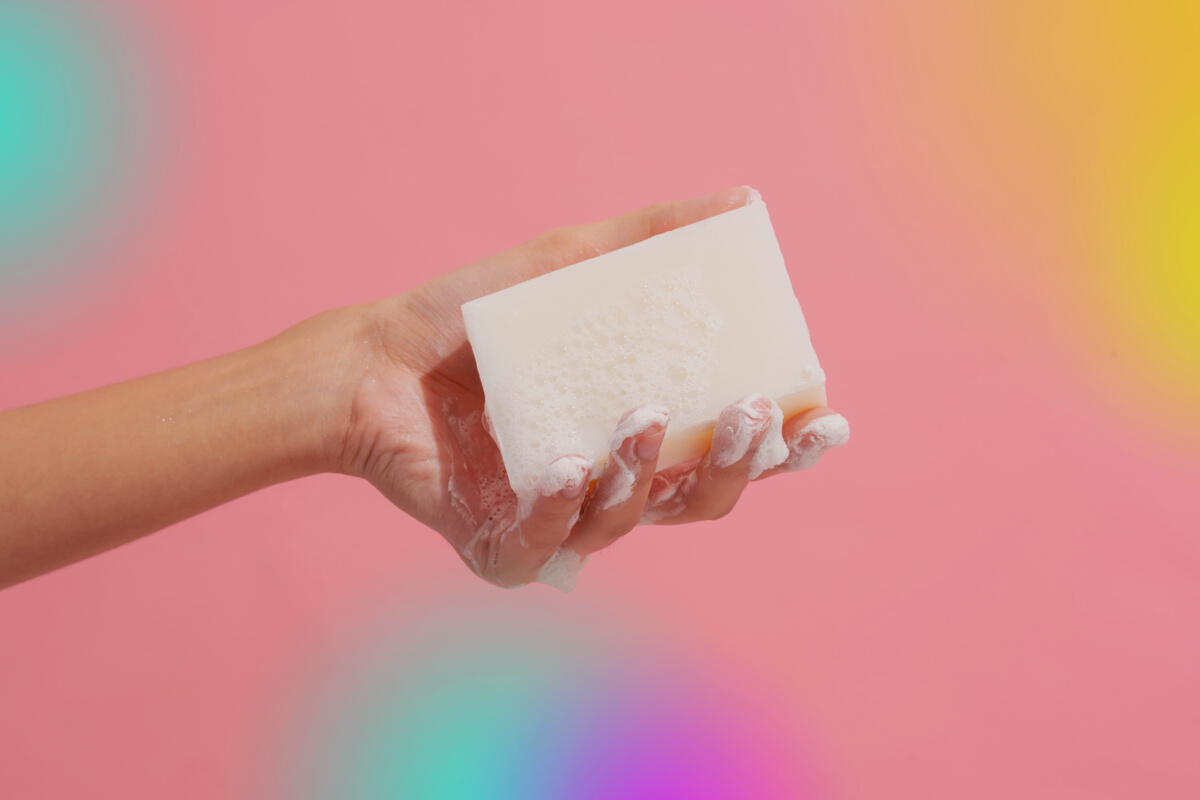 Person's Hand Holding a Wet Soap